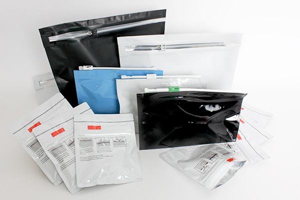 pile of black and white child safe pouches of various sizes and styles